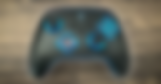 A black PowerA controller featuring blue lights around all the trim and buttons.